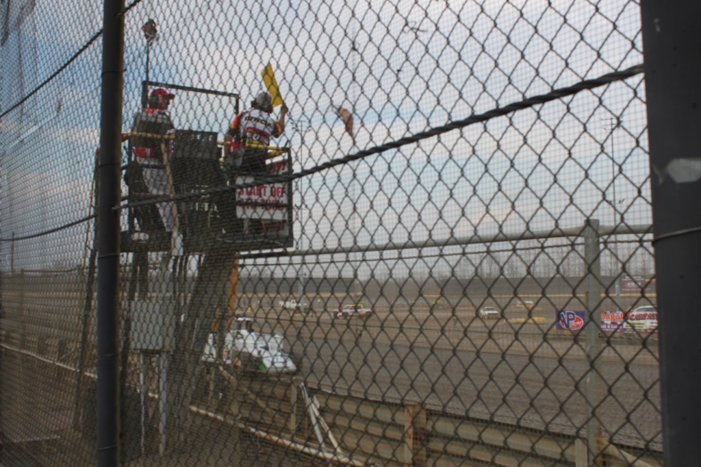 Flagger on the tower above the track